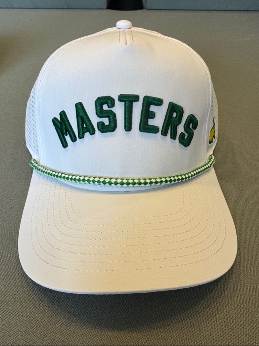 2026 Masters White Tag with Yellow Map Logo and Red Flag